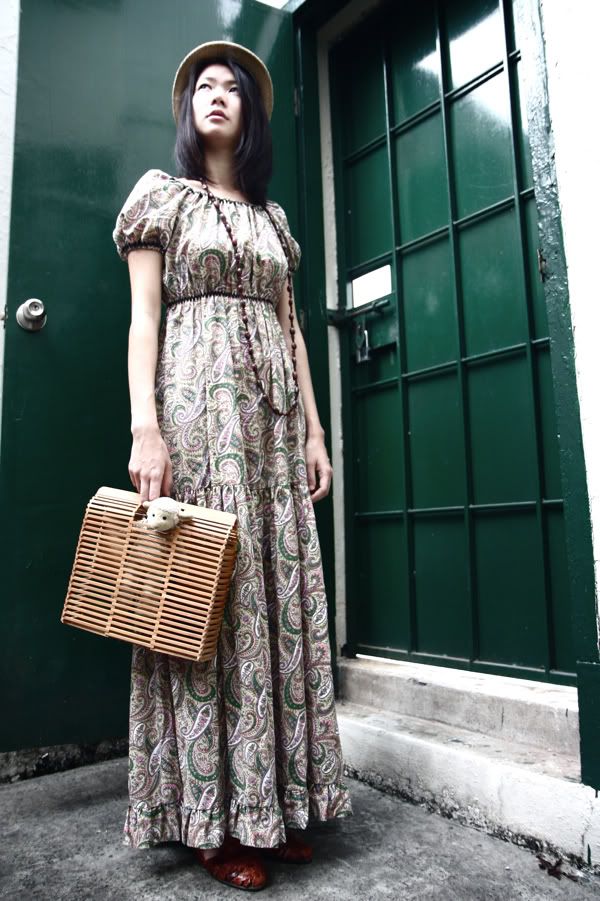 Oli gets ready to step out with Lambchop in a 1970s maxi printed smock dress, beaded necklace, comfy leather woven sandals and the cutest cane bag from the 1970s!