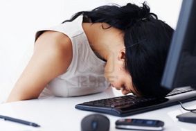 10362773-tired-business-woman-sleeping-on-the-keyboard-in-office.jpg